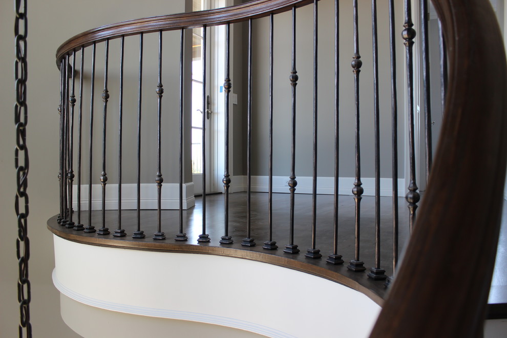 Expansive nautical wood spiral mixed railing staircase in Other with wood risers.