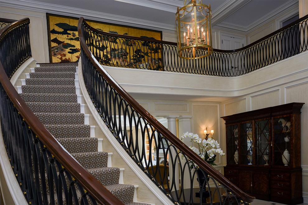 Large trendy carpeted curved staircase photo in Detroit with carpeted risers
