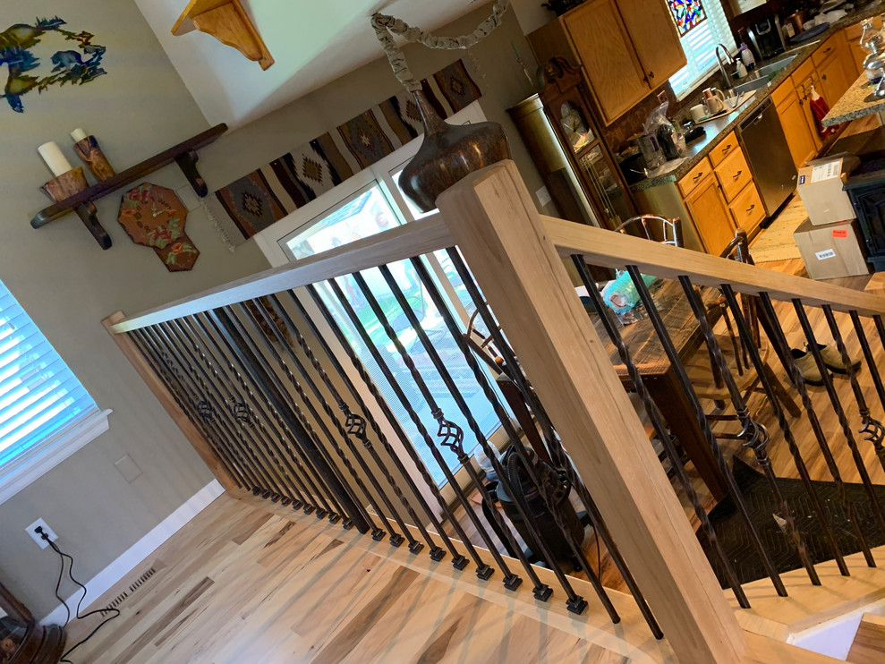 Design ideas for a medium sized straight wood railing staircase in Denver.