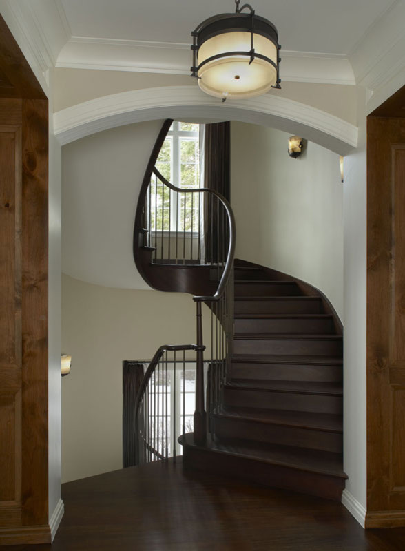 Inspiration for a huge timeless wooden spiral wood railing staircase remodel in Detroit with wooden risers