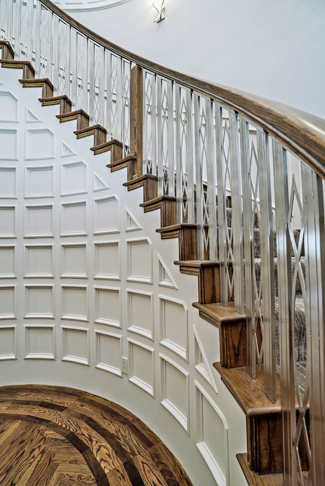 Huge elegant carpeted curved mixed material railing staircase photo in Oklahoma City with carpeted risers
