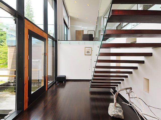 Example of a small trendy wooden floating open staircase design in Ottawa