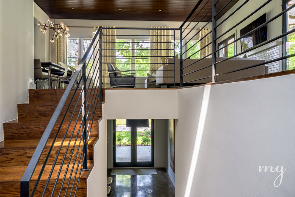 Стильный дизайн: огромная угловая деревянная лестница в стиле модернизм с деревянными ступенями - последний тренд