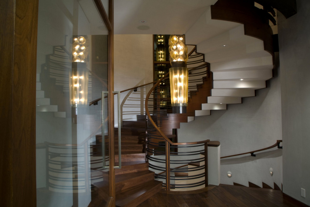 This is an example of a large contemporary metal spiral staircase in Other.