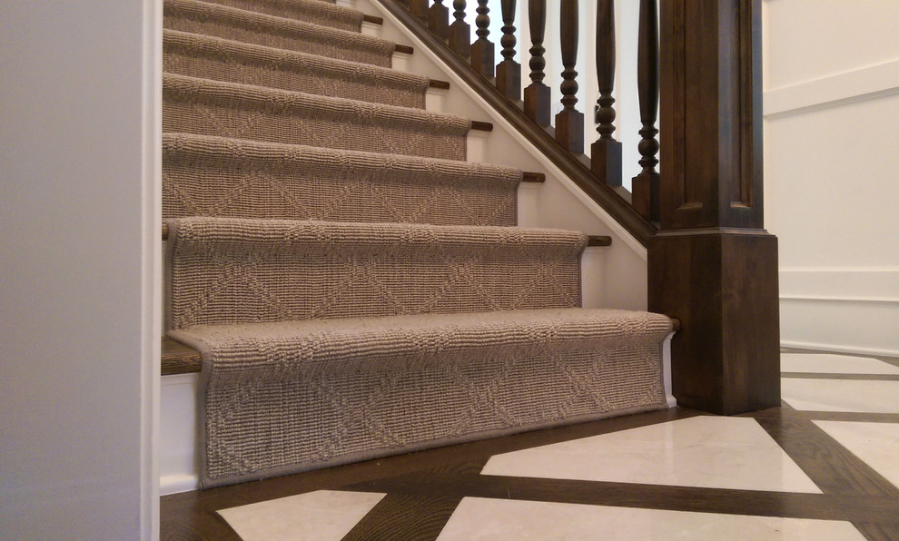 Photo of a medium sized carpeted straight staircase in Denver with carpeted risers.