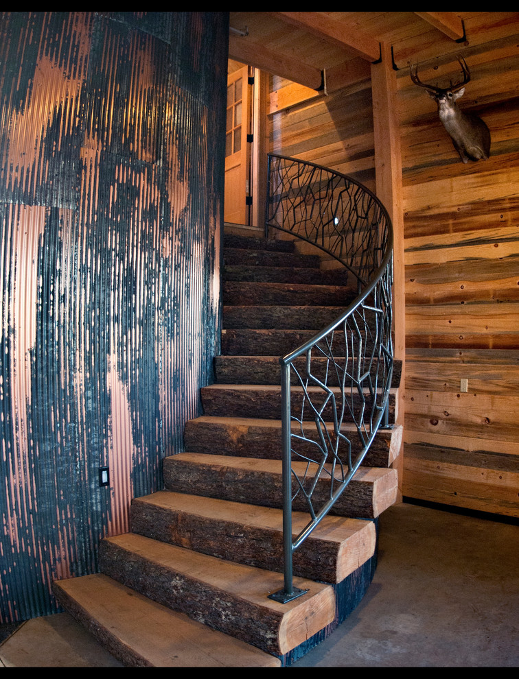 Inspiration for a large rural wood curved staircase in Portland with wood risers.