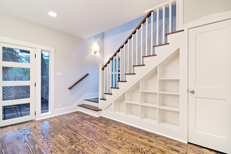 Design ideas for a traditional staircase in Austin with under stair storage.