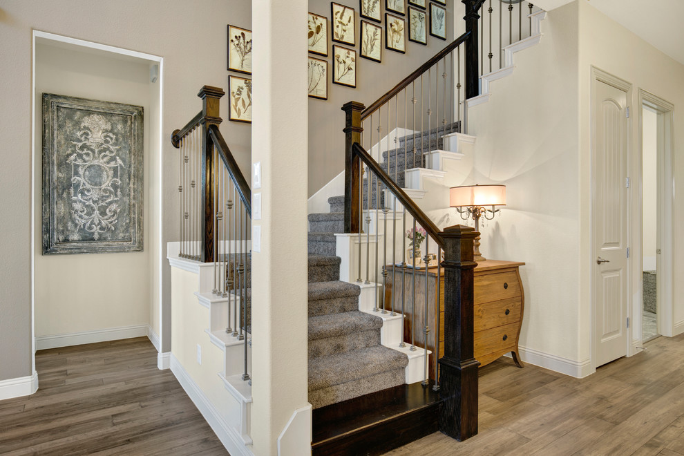 Example of a large carpeted u-shaped staircase design in Dallas with carpeted risers