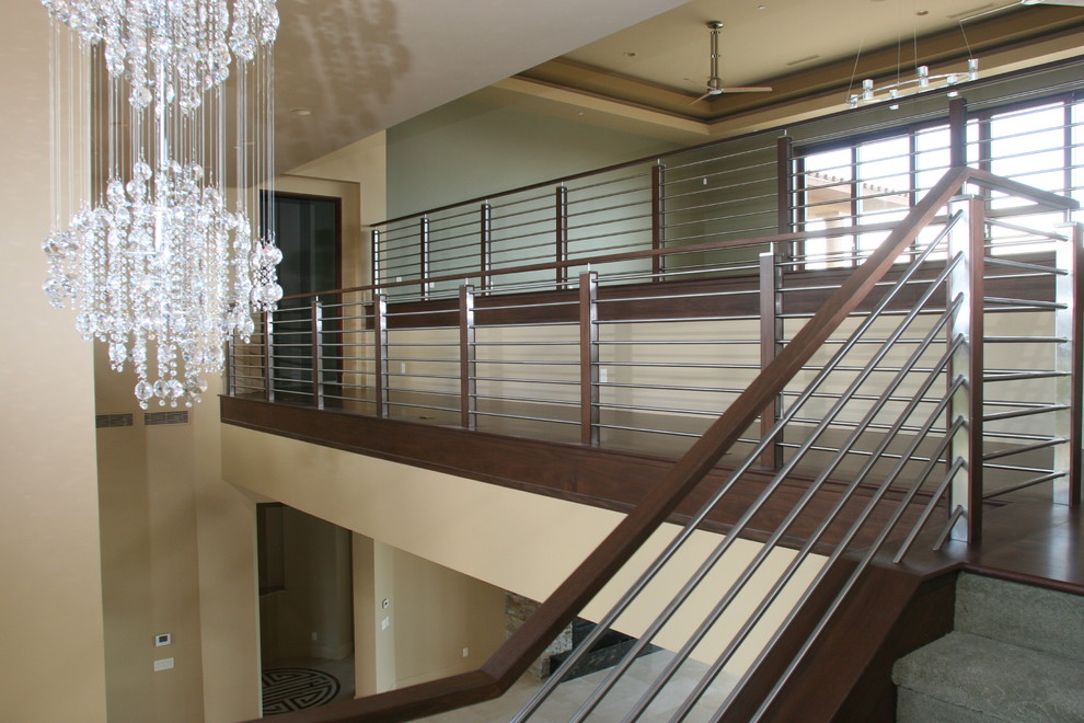 Staircase - modern carpeted curved staircase idea in Las Vegas with carpeted risers