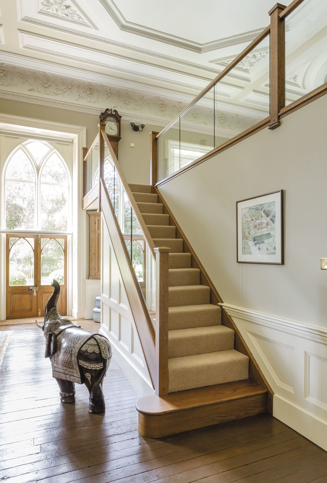 Staircase - large traditional wooden straight wood railing staircase idea in Manchester with wooden risers