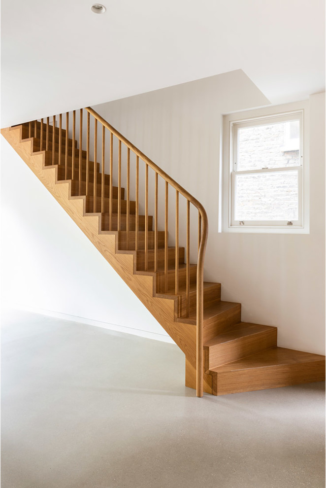 Inspiration for a medium sized contemporary wood straight wood railing staircase in London with wood risers.