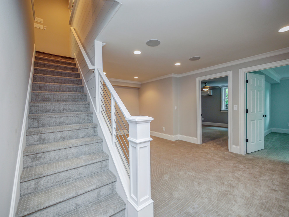 Inspiration for a small 1950s carpeted straight mixed material railing staircase remodel in Charlotte with carpeted risers