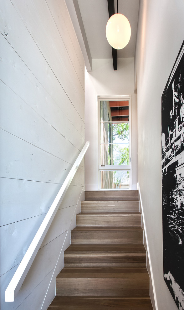 Design ideas for a small contemporary wood straight staircase in Dallas with wood risers.