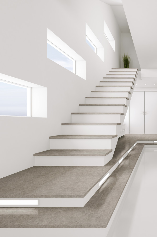 This is an example of an expansive contemporary floating staircase in Grand Rapids with open risers.