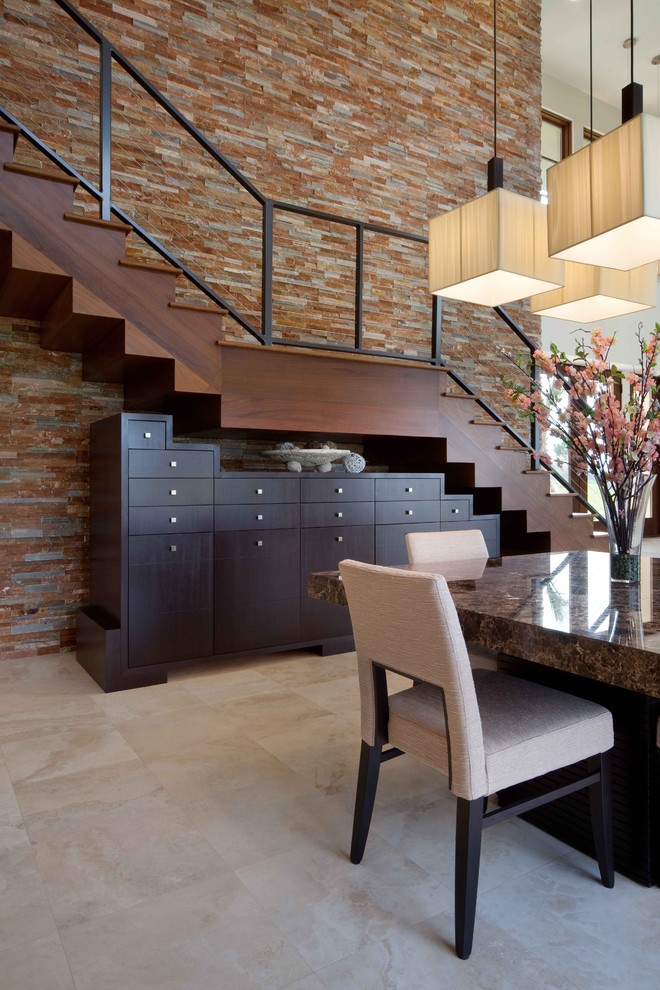 Design ideas for a contemporary staircase in Orlando with under stair storage.