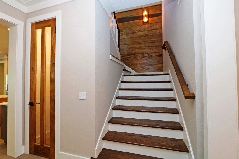 Inspiration for a medium sized contemporary wood u-shaped wood railing staircase in Orlando with painted wood risers.