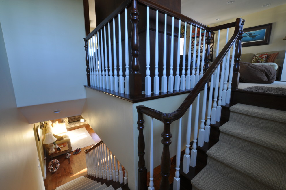 Design ideas for a large classic wood straight staircase in Los Angeles with wood risers.