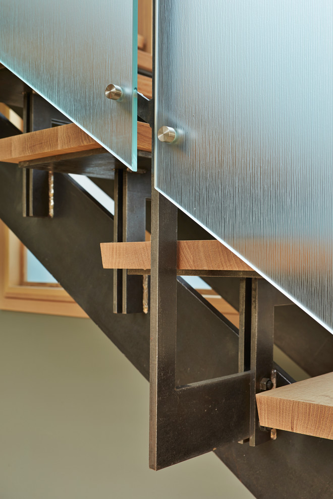 Inspiration for a medium sized modern wood u-shaped staircase in Seattle with open risers.