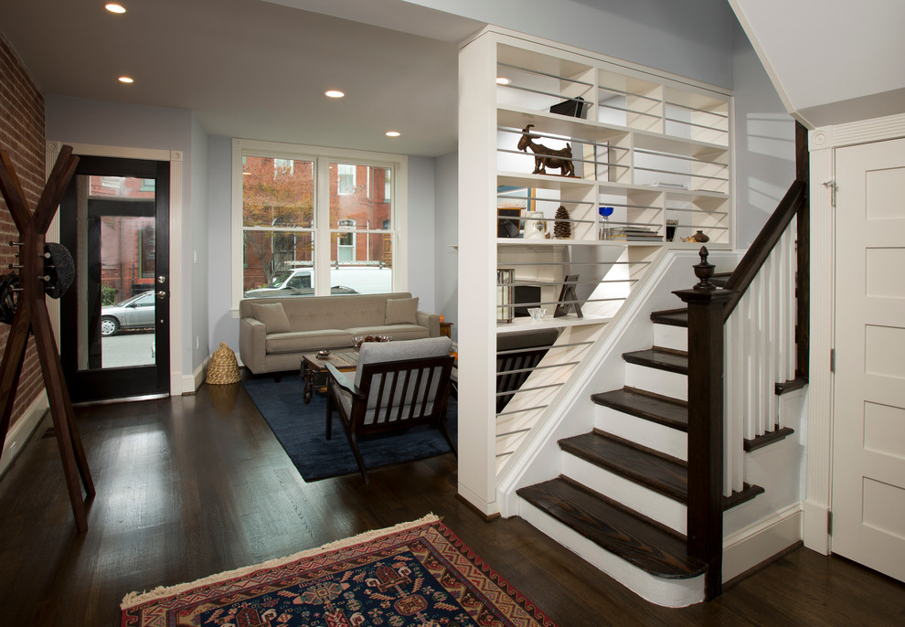 Example of a small transitional wooden l-shaped staircase design in DC Metro with painted risers