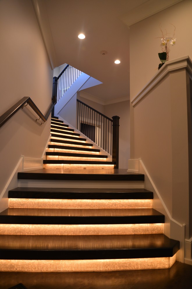 Staircase - large transitional wooden floating staircase idea in Chicago with glass risers
