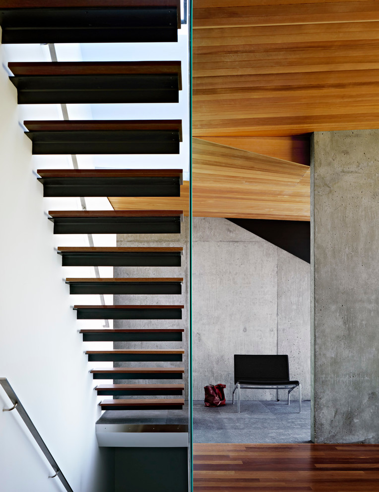 Design ideas for a small modern wood floating staircase in San Francisco with open risers.