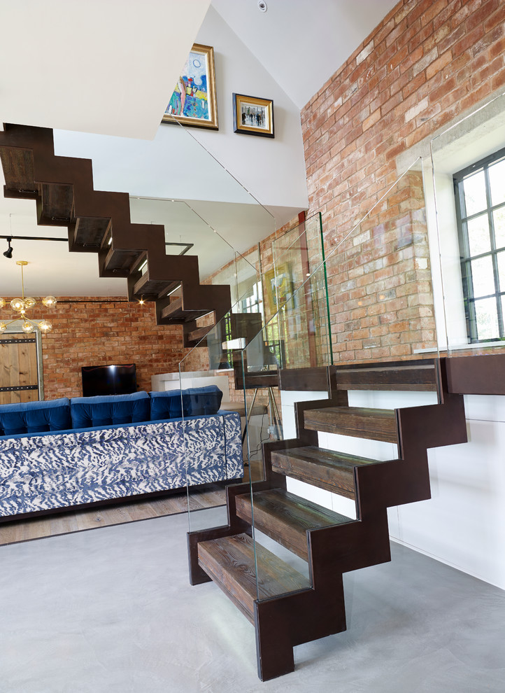 Design ideas for an industrial wood staircase in Other with wood risers and feature lighting.