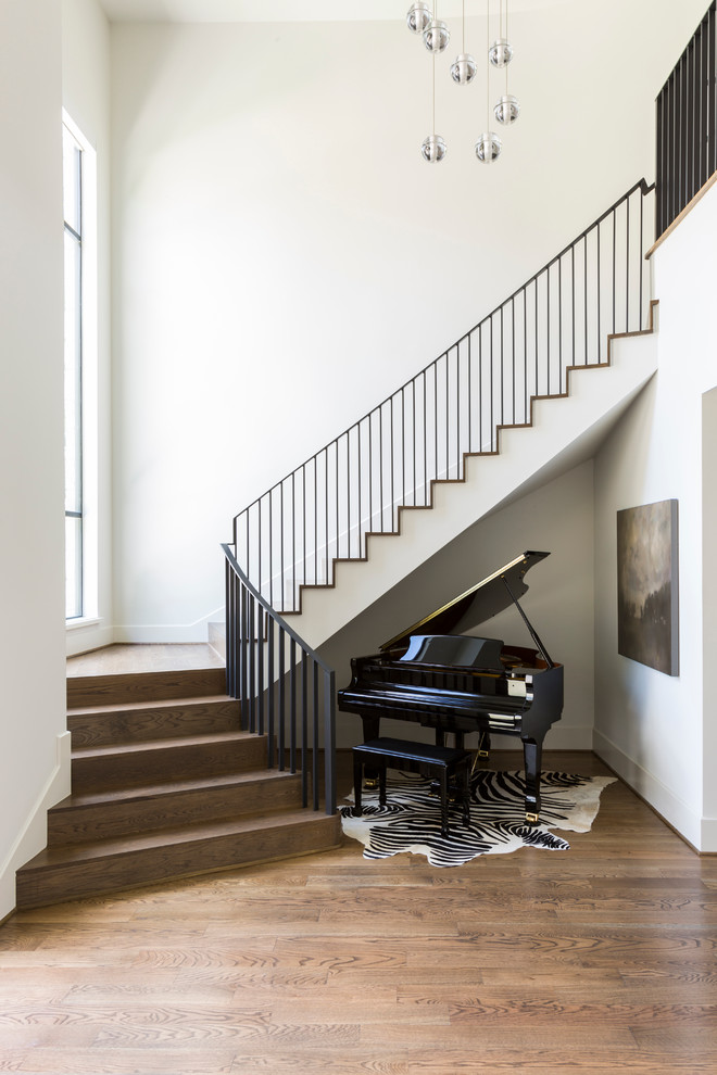 Transitional wooden staircase photo in Houston with wooden risers