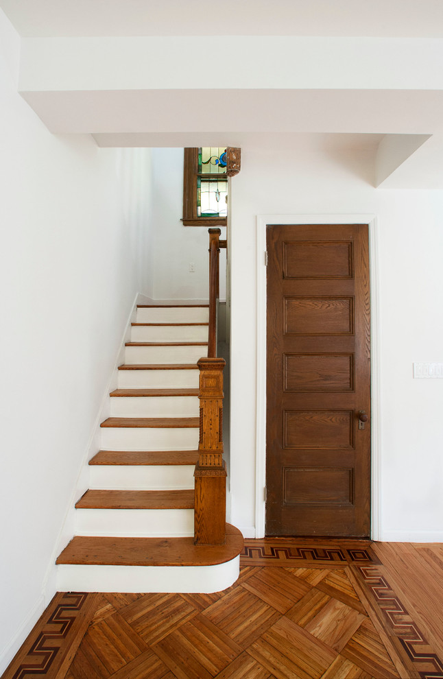Inspiration for a timeless wooden staircase remodel in New York