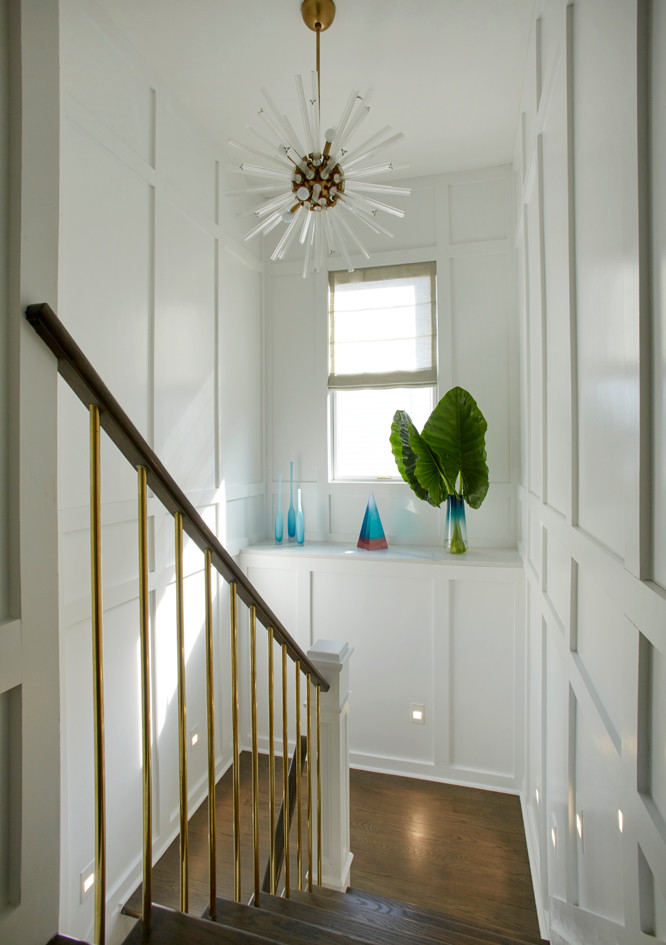 Inspiration for a mid-sized transitional u-shaped mixed material railing staircase remodel in New York