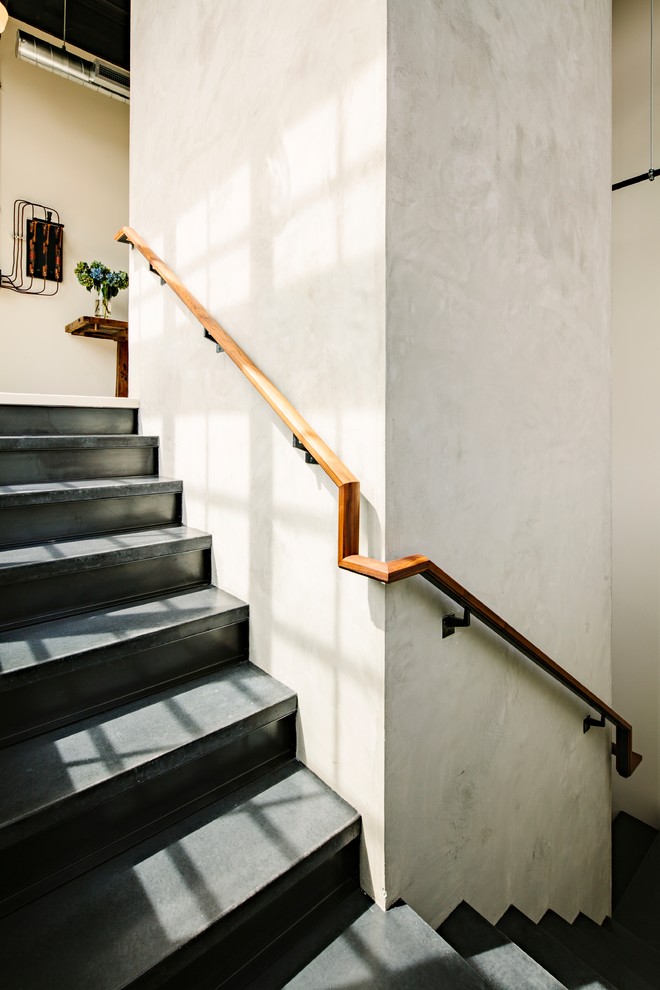 This is an example of an industrial concrete staircase in Portland with concrete risers.