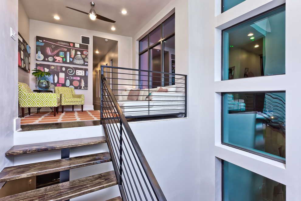 Example of a mid-sized trendy wooden floating open staircase design in Austin