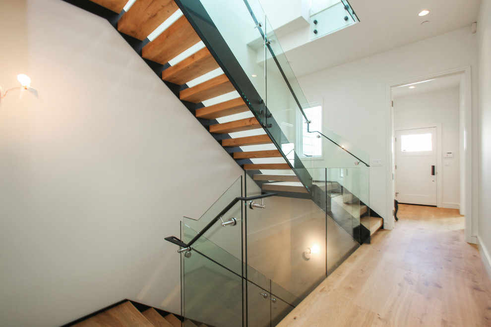 Design ideas for a large contemporary wood l-shaped mixed railing staircase in San Francisco with open risers.