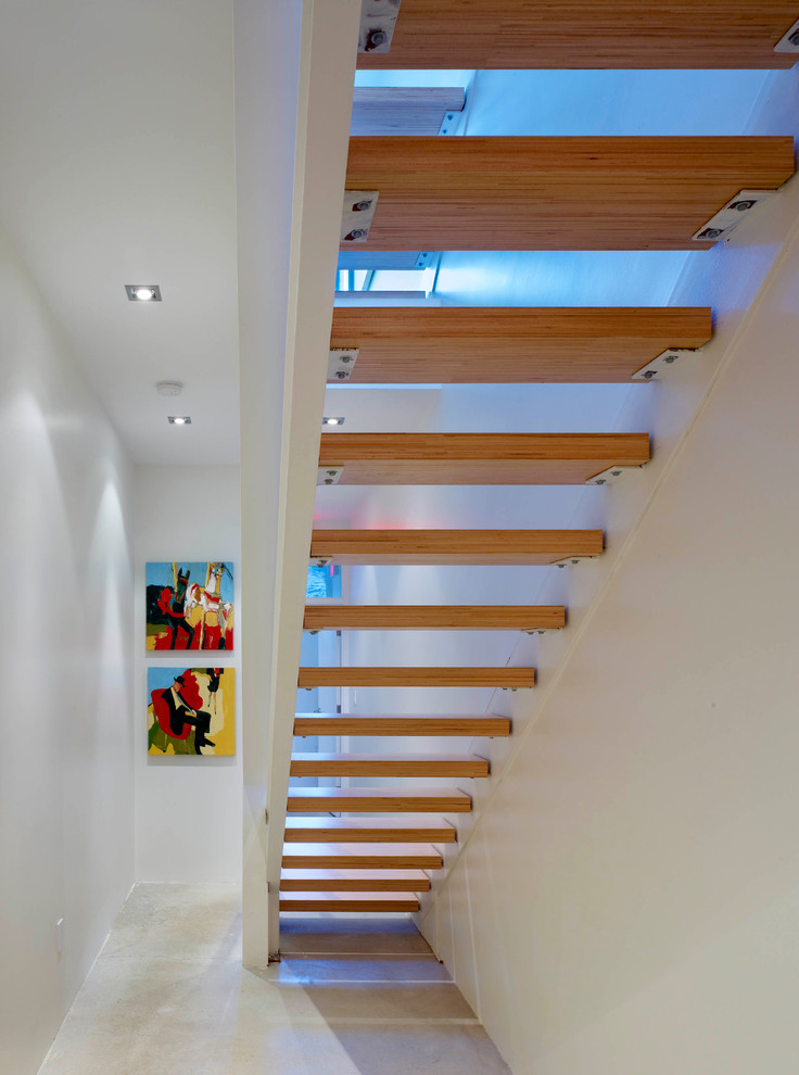 Staircase - small modern wooden straight open staircase idea in Toronto