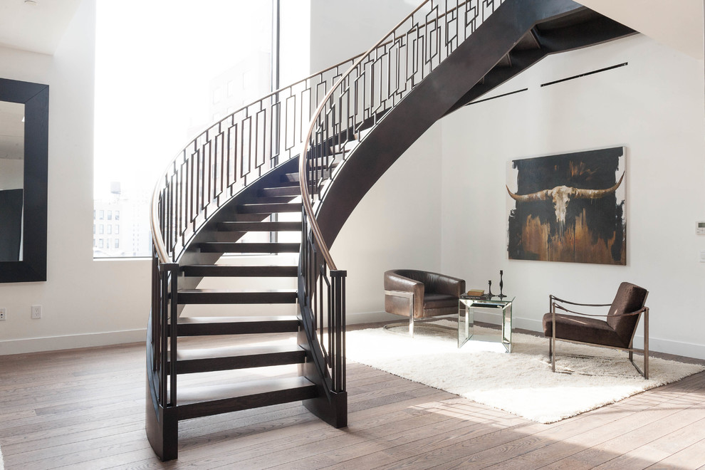 Design ideas for a contemporary curved staircase in New York with open risers.