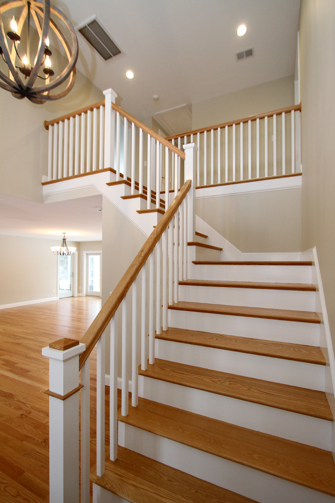 Example of a mid-sized trendy wooden l-shaped staircase design in Boston with painted risers