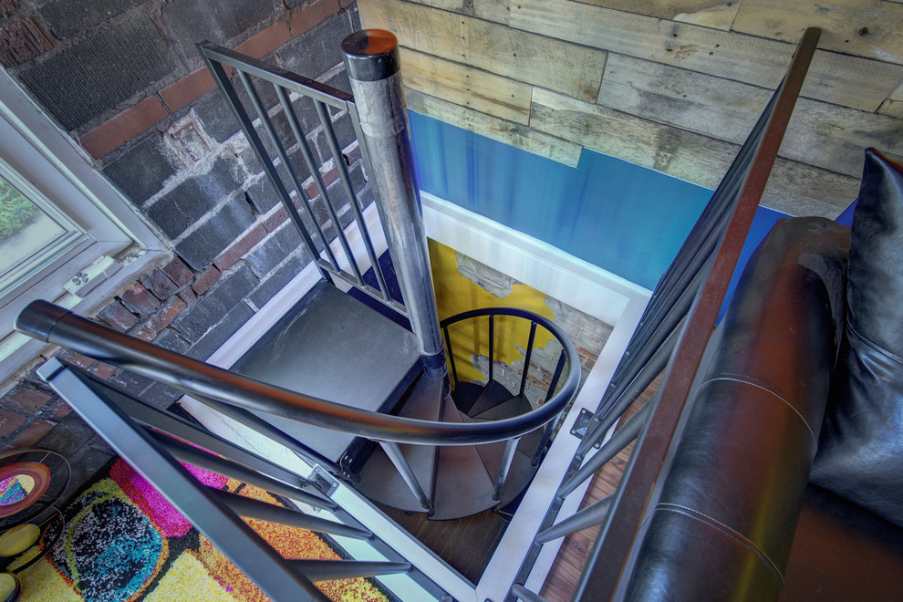 Design ideas for a small eclectic metal spiral staircase in Indianapolis with metal risers.