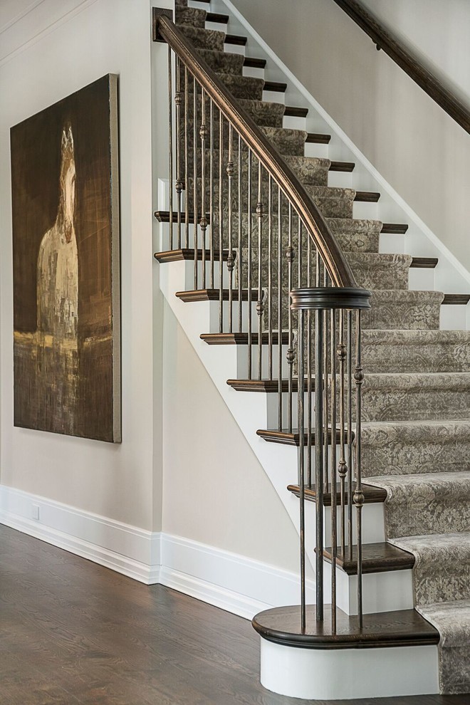 Example of a mid-sized classic carpeted straight metal railing staircase design in Chicago with wooden risers