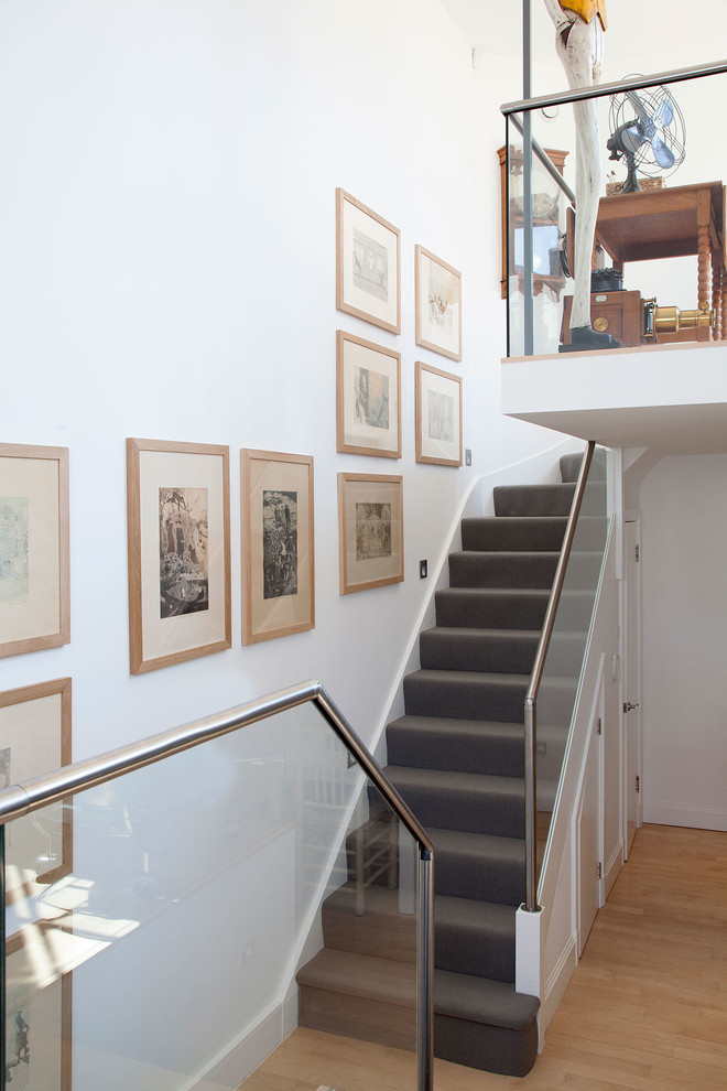 This is an example of a contemporary staircase in London with under stair storage.