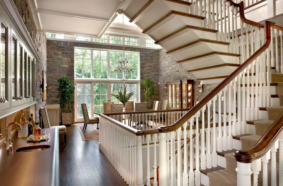Staircase - huge traditional wooden l-shaped staircase idea in Chicago with painted risers