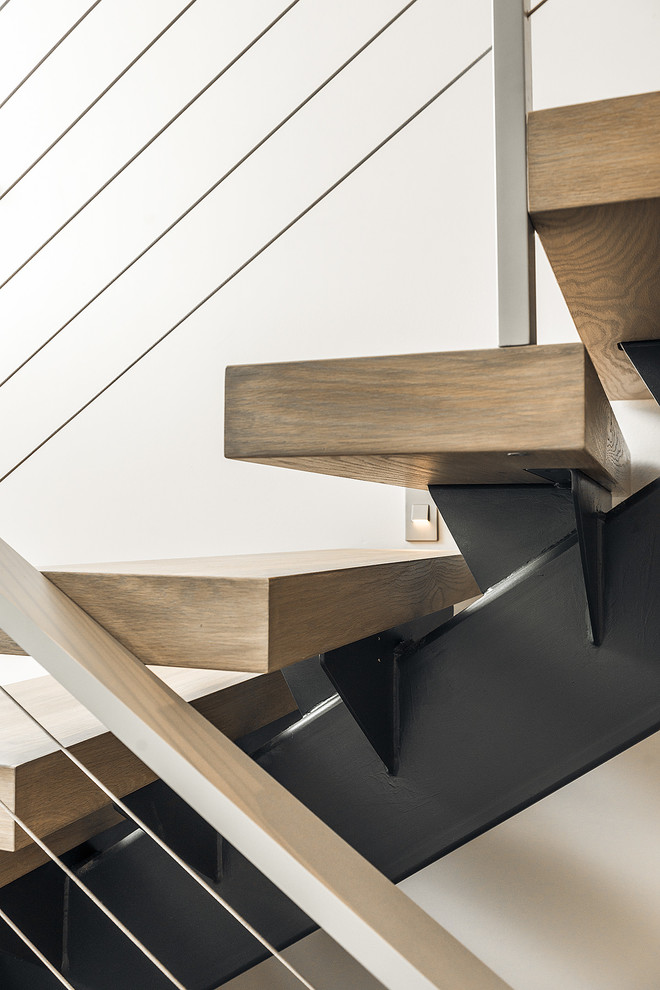 Inspiration for a medium sized contemporary wood floating staircase in Vancouver with open risers.
