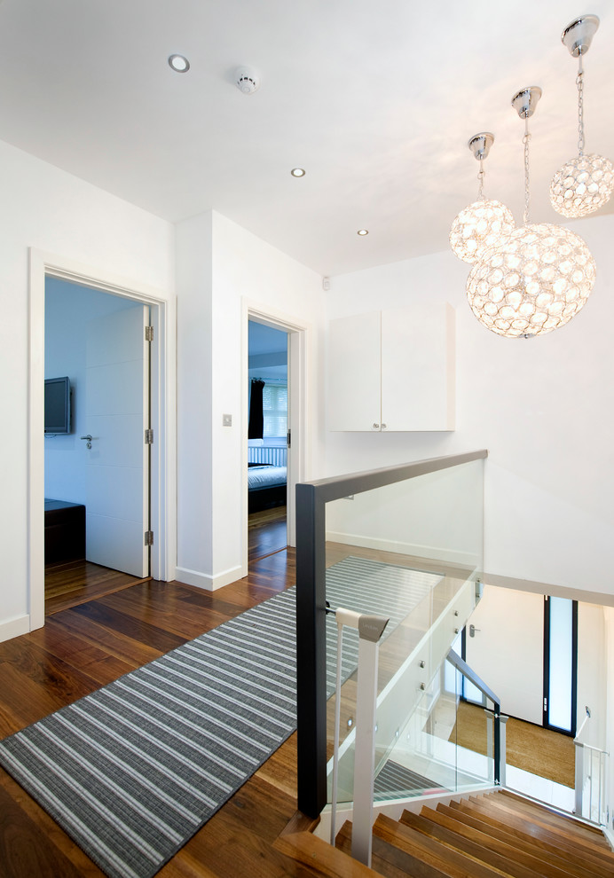This is an example of a contemporary wood straight staircase in London.