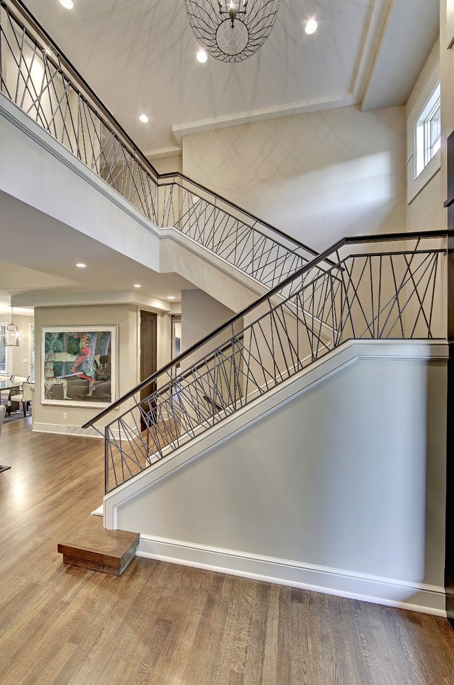 Example of a transitional u-shaped staircase design in Minneapolis
