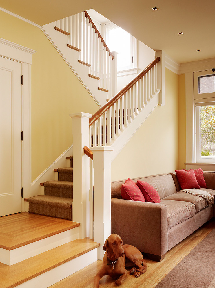 Inspiration for a classic wood l-shaped staircase in San Francisco with painted wood risers.