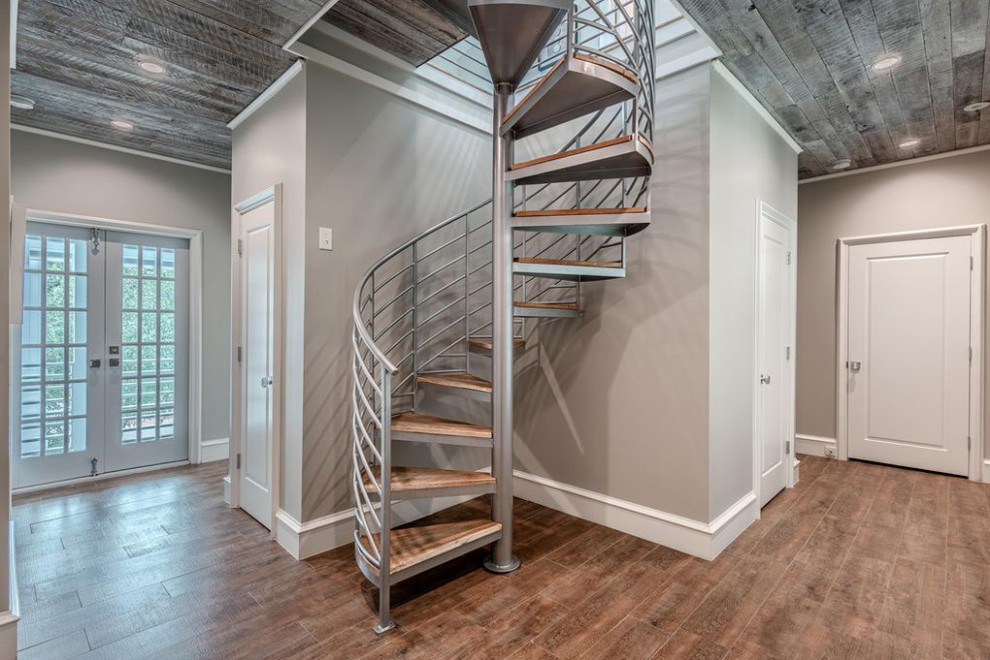 Design ideas for a traditional wood spiral metal railing staircase in Other.