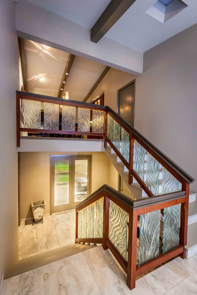 Inspiration for a mid-sized contemporary concrete u-shaped staircase remodel in Seattle with tile risers