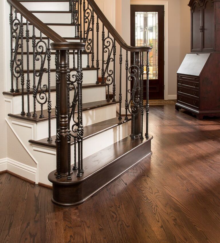 Staircase - mid-sized traditional wooden curved mixed material railing staircase idea in Houston with painted risers