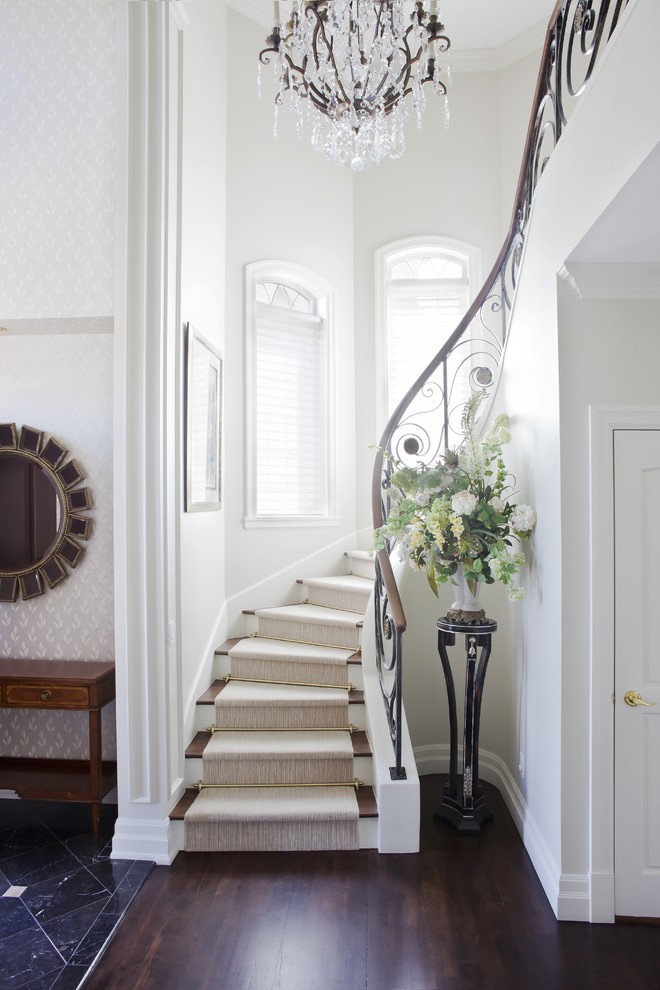 Inspiration for a transitional wooden curved staircase remodel in Montreal with wooden risers
