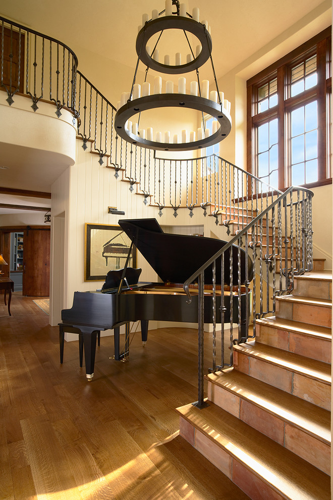 Inspiration for a timeless wooden staircase remodel in Minneapolis with tile risers