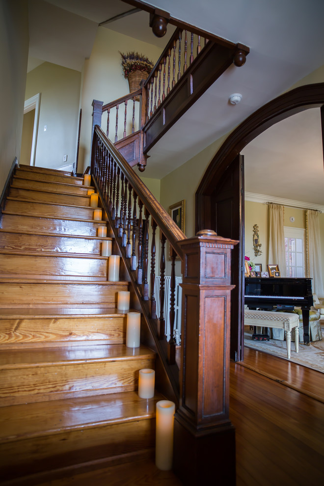 This is an example of a medium sized victorian wood straight wood railing staircase in DC Metro with wood risers.