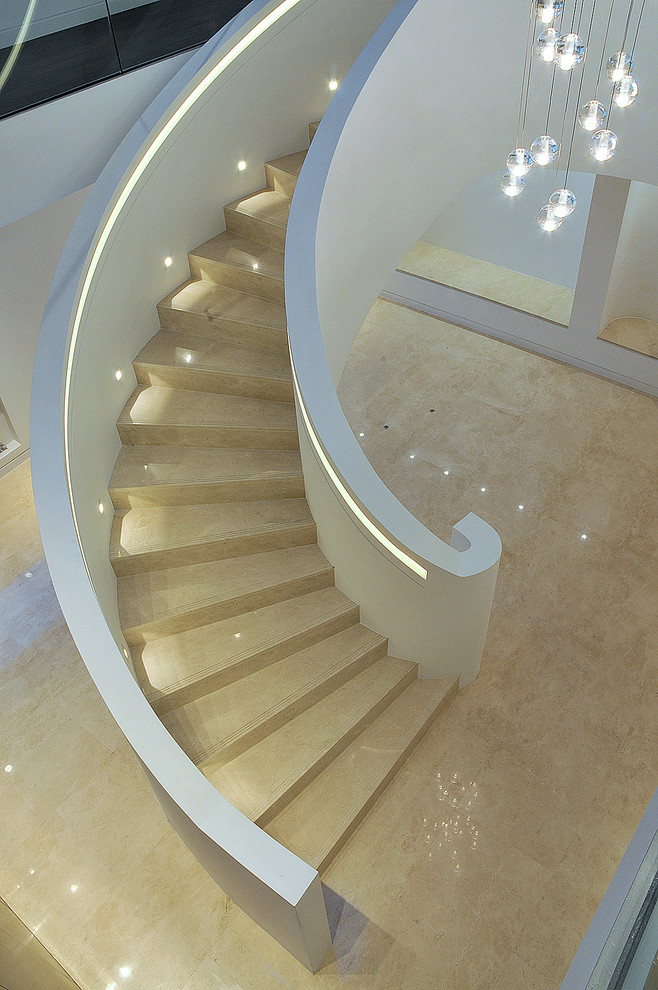 This is an example of a modern curved staircase in London.